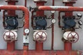 Red pipes with valves and manometers Royalty Free Stock Photo