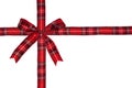 Red plaid Christmas gift bow and ribbon arranged as wrapped gift box isolated on white Royalty Free Stock Photo