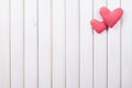 Red plaid hearts on white fence Royalty Free Stock Photo