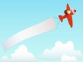 Red plane with advertising banner in sky Royalty Free Stock Photo