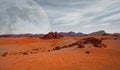 Red planet with arid landscape, rocky hills and mountains, and a giant Mars-like moon at the horizon