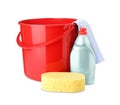 Red plastic bucket, bottle of detergent and cleaning tools on white background Royalty Free Stock Photo