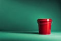 Red plastic bucket for cleaning isolated on pastel background. Copy space on pastel background. Royalty Free Stock Photo