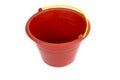 Red plastic bucket with yellow handle isolated on white background Royalty Free Stock Photo