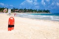 Red plastic buoy for a lifeguard ready to save people on beach Royalty Free Stock Photo