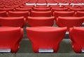 Red plastic chairs at the stadium Royalty Free Stock Photo