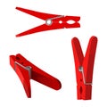 Red plastic clothespins in three positions