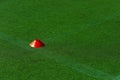 Red plastic cone on a fooball field