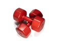 Red Plastic Dumbells Placed On Each Other, Isolated On White Background