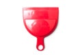 Red plastic dust shovel on white background