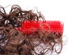 Red plastic hairbrush and hair Royalty Free Stock Photo