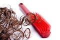 Red plastic hairbrush and hair Royalty Free Stock Photo