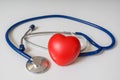 Red plastic heart and stethoscope on white background Royalty Free Stock Photo
