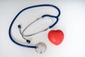 Red plastic heart and stethoscope on white background Royalty Free Stock Photo