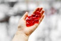 Red plastic hearts are in a hand Royalty Free Stock Photo