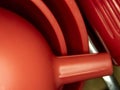 Red plastic kitchen funnels stacked together Royalty Free Stock Photo