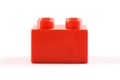 Red plastic lego/duplo block on white background Royalty Free Stock Photo