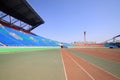 Red plastic runway and building in a sports ground