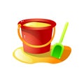 Red plastic sand bucket with green shovel toy Royalty Free Stock Photo