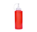 Red plastic sauce bottle isolated on white