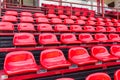 Red plastic seats in stadium Royalty Free Stock Photo