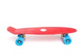 Red plastic skateboard on white background Royalty Free Stock Photo
