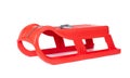 Red plastic sled for snow skiing isolated on white background. File contains a path to isolation.