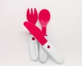 Red plastic knife, spoon and fork Royalty Free Stock Photo