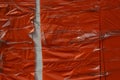 Red plastic texture from crumpled cellophane wrapped