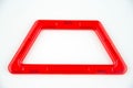 Red plastic trapezoid from transparent magnet kit (puzzle builder for kids) isolated