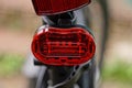 Red plastic warning light on a black sports bike