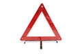 Red plastic warning triangle isolated white background