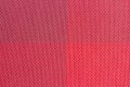 red plastic woven fabric samples, texture background Royalty Free Stock Photo