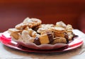 Red plate of assorted homemade christmas cookies