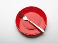 Red plate with single fork Royalty Free Stock Photo