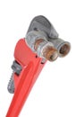 Red plumbers pipe wrench and plumbing component Royalty Free Stock Photo