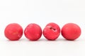 Red plums on white background