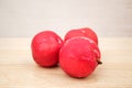 Red plums on white background