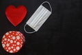 Red plush heart with face mask on stone background. Top view copy space. Valentines day concept. Royalty Free Stock Photo