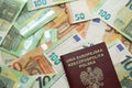 Red polish passport and big amount of european euro money bills Royalty Free Stock Photo