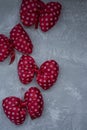 Red polka dot bows. Plush bow A toy. Light background under the concrete. Space for text