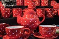Red polka dot tea pottery set for sale Royalty Free Stock Photo