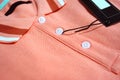 Red Polo T-shirt and blank label close up. Royalty Free Stock Photo