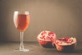 Red pomegranate juice in a glass/Red pomegranate juice in a glass on a dark background with copyspace, selective focus Royalty Free Stock Photo