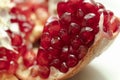 Red pomegranate seeds, white background. Mono Shooting. Juicy bright red fruit. Love Royalty Free Stock Photo