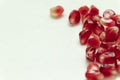 Red pomegranate seeds, white background. Mono Shooting. Juicy bright red fruit. Love Royalty Free Stock Photo