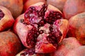 A red pomegranate split into pieces