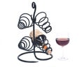 Red pomegranate wine, wine straw bottle and iron wine bottle holder Royalty Free Stock Photo