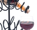 Red pomegranate wine, wine straw bottle and iron wine bottle holder Royalty Free Stock Photo