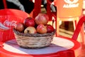 Red pomegranates on small table Royalty Free Stock Photo